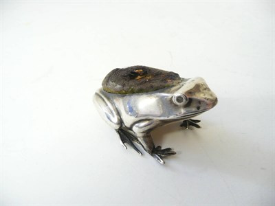 Lot 305 - A Silver Mounted Frog Pin Cushion, Henry Matthews, Birmingham 1908, modelled in crouched...