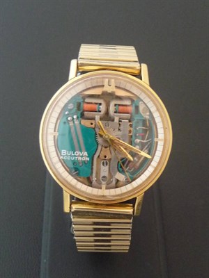 Lot 344 - A Steel and Gilt Electronic Accutron Wristwatch, signed Bulova, So called: space view, tuning...