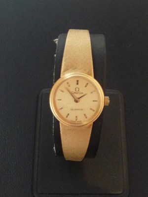 Lot 388 - A Lady's 18ct Gold Quartz Wristwatch, signed Omega, circa 1980, quartz movement, gilt coloured dial