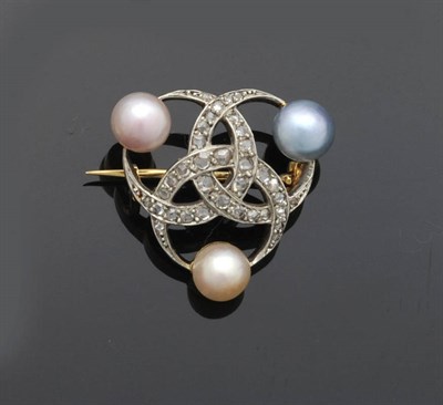 Lot 437 - An Edwardian Cultured Pearl and Diamond Brooch, three interlocking crescents set with rose cut...