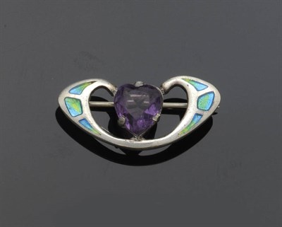 Lot 438 - A Silver Amethyst and Enamel Brooch, by Charles Horner, 1907, the heart shaped amethyst in a...