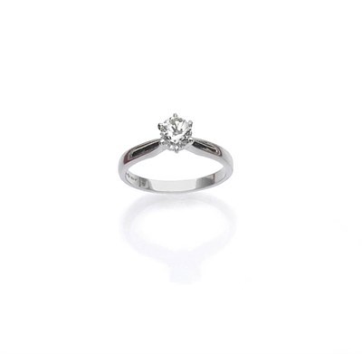 Lot 441 - A Platinum Diamond Solitaire Ring, the round brilliant cut diamond in a six claw setting,...