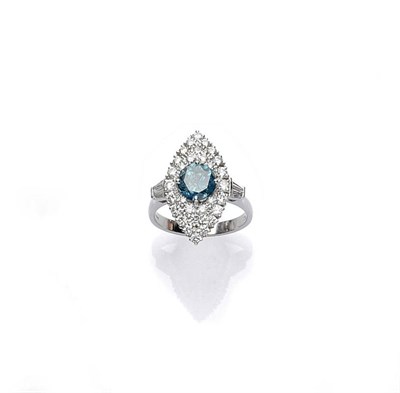 Lot 447 - An 18 Carat White Gold Blue and White Diamond Cluster Ring, the treated blue round brilliant...