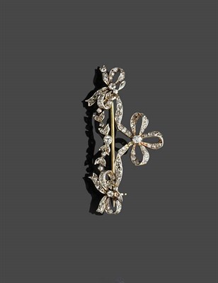 Lot 455 - An Edwardian Diamond Bow Brooch, old cut diamonds in claw settings, total diamond weight 0.90 carat