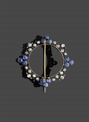 Lot 456 - A Circular Sapphire and Diamond Brooch, old cut diamonds are alternated with trios of sapphires, in