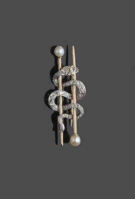 Lot 476 - A Diamond and Pearl Snake Brooch, two gold pins with pearl heads are spaced by an entwined...