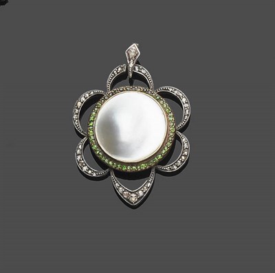 Lot 480 - A Mother of Pearl, Demantoid Garnet and Diamond Pendant, the round mother of pearl disk sits within