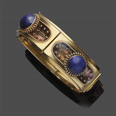 Lot 483 - A Lapis Lazuli Bangle, four panels decorated with granulation and ropework are set with a round...