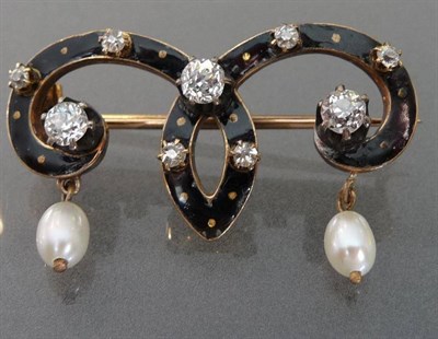 Lot 487 - A Diamond, Pearl and Enamel Brooch, the black enamelled scroll brooch with gold disk detail is...