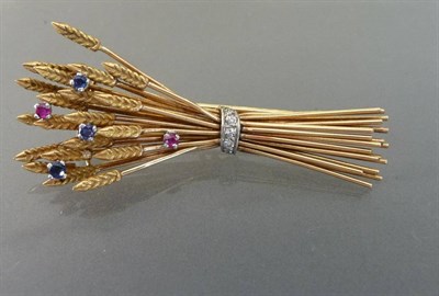 Lot 493 - A Ruby, Sapphire and Diamond Sheaf of Corn Brooch, realistically modelled with eight-cut...