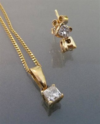 Lot 494 - A Princess Cut Diamond Solitaire Pendant on Chain, the diamond in a four claw setting on a fine...