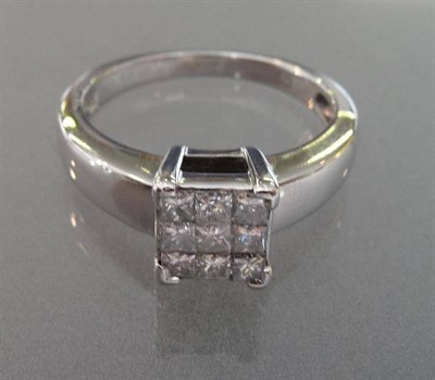 Lot 495 - An 18 Carat White Gold Princess Cut Diamond Cluster Ring, the nine diamonds in a tension claw...