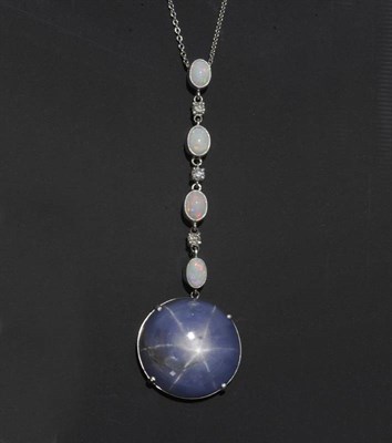 Lot 497 - A Star Sapphire, Opal and Diamond Pendant on Chain, the large round cabochon sapphire is...