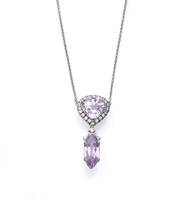 Lot 505 - A Kunzite and Diamond Pendant on Chain, a trillion cut kunzite within a border of round...