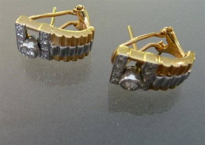 Lot 518 - A Pair of Two Colour Diamond Cuff Earrings, the grooved cuff has a sliding round brilliant cut...