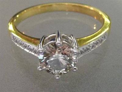 Lot 522 - A Diamond Solitaire Ring, the round brilliant cut diamond in white claw settings with diamonds...