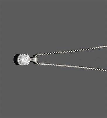 Lot 528 - An 18 Carat White Gold Diamond Solitaire Pendant on Chain, the round brilliant cut diamond in...