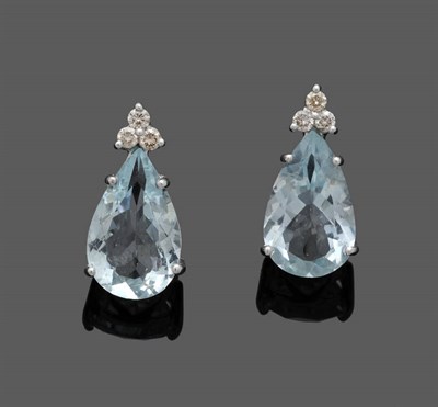 Lot 531 - A Pair of Aquamarine and Diamond Earrings, a cluster of three round brilliant cut diamonds surmount