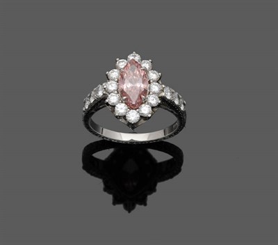 Lot 532 - A Pink and White Diamond Cluster Ring, the pink marquise cut diamond within a border of white round