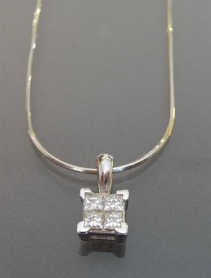 Lot 543 - An 18 Carat White Gold Princess Cut Diamond Cluster Pendant on Chain, the four princess cut...