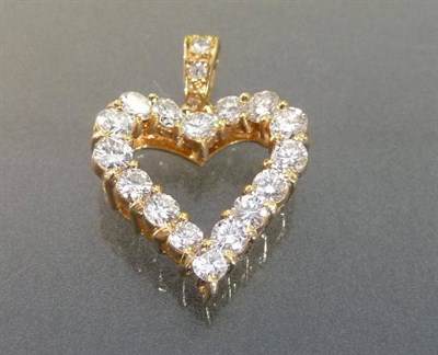 Lot 544 - An 18 Carat Gold Diamond Heart Pendant, the round brilliant cut diamonds set in a shaped heart with