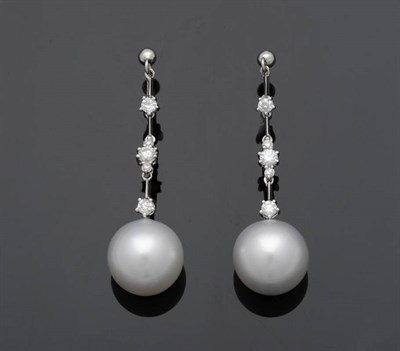 Lot 549 - A Pair of Diamond and Cultured South Sea Pearl Drop Earrings, the round brilliant cut diamonds...