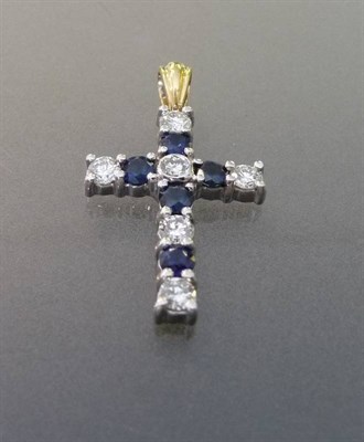 Lot 562 - An 18 Carat Gold Sapphire and Diamond Cross Pendant, the round brilliant cut diamonds and sapphires