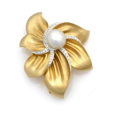 Lot 567 - A Pearl and Diamond Set Floral Brooch, a central pearl set with diamonds around the textured...