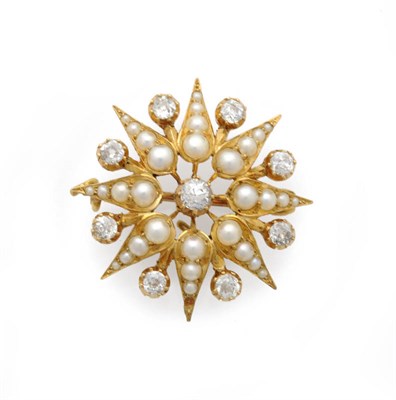 Lot 569 - A Victorian Diamond and Seed Pearl Star Brooch, an old cut diamond centres eight radial arms...