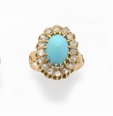 Lot 574 - A Turquoise and Diamond Cluster Ring, the domed cabochon turquoise within a border of rose cut...