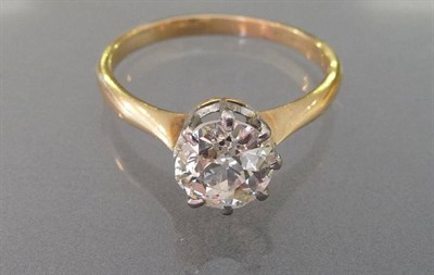 Lot 582 - A Diamond Solitaire Ring, the old cut diamond in a white claw setting on a plain polished...