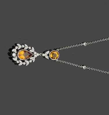 Lot 590 - A Citrine and Diamond Necklace, a round brilliant cut citrine suspends a pear cut citrine...