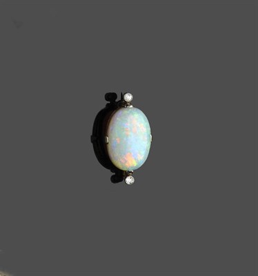 Lot 595 - An Opal and Diamond Three Stone Brooch, an oval cabochon opal flanked by a millegrain set...