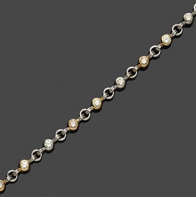 Lot 599 - A Three Colour Diamond Bracelet, the round brilliant cut diamonds in three hues - the white held in