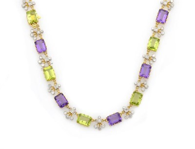 Lot 610 - An Amethyst, Peridot and Diamond Necklace, alternating step cut amethysts and peridots spaced...