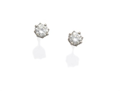 Lot 612 - A Pair of 18 Carat White Gold Diamond Solitaire Stud Earrings, the round brilliant cut diamonds...