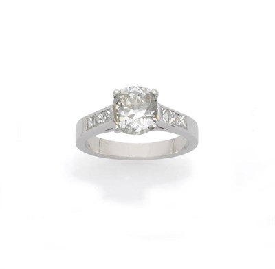 Lot 620 - An 18 Carat White Gold Diamond Solitaire Ring, the old cut diamond claw set in a modern setting...