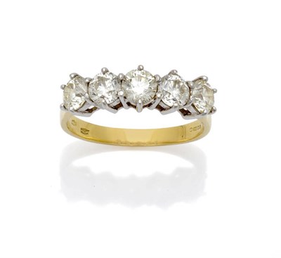 Lot 623 - An 18 Carat Gold Diamond Five Stone Ring, the round brilliant cut diamonds in white claw...