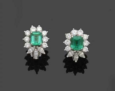 Lot 637 - A Pair of Emerald and Diamond Cluster Earrings, the emerald-cut emeralds within a border of...