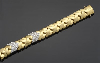 Lot 643 - A Diamond Chevron Bracelet, yellow staggered crossover bars with two diamond set double chevron...