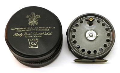 Lot 3064 - A Hardy 3 3/8in Alloy 'St.George' Fly Reel, with black handle on pierced drum, three screw drum...