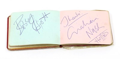 Lot 3152 - Autograph Book including Bobby Elliott and Graham Nash (Hollies), Bert Trautmann, Tom Finney,...