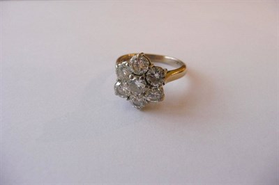 Lot 651 - An 18 Carat White Gold Diamond Cluster Ring, the round brilliant cut diamonds in claw settings to a