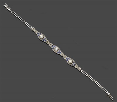 Lot 663 - A Sapphire and Diamond Bracelet, circa 1920, three panels set with an old cut diamond...