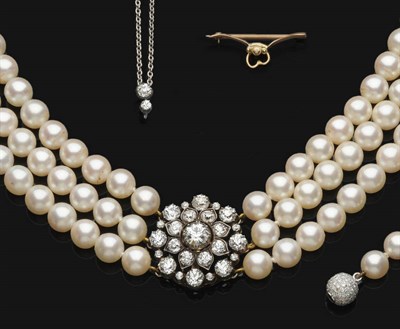 Lot 669 - A Three Row Cultured Pearl Choker with Diamond Centrepiece, the 42:43:46 cultured pearls each...