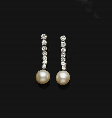 Lot 670 - A Pair of Diamond and Pearl Drop Earrings, each with seven round brilliant cut diamonds in...