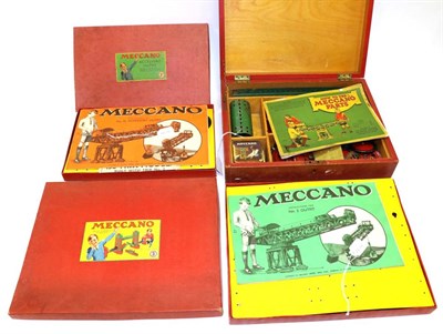 Lot 3451 - Meccano Red Wooden Box containing various red/green and brass parts and a How To Use Meccano...