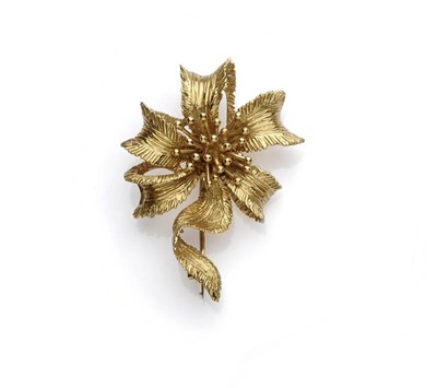 Lot 681 - An 18 Carat Gold Stylised Floral Brooch, by Kutchinsky, textured petals and stem centred by stamen