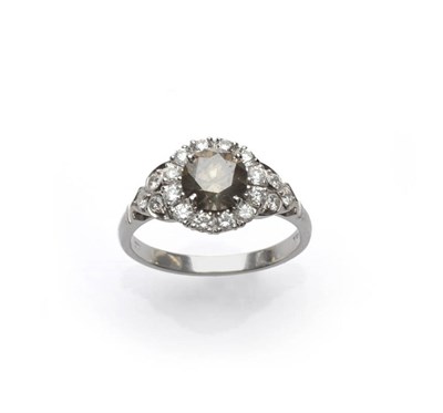 Lot 684 - An 18 Carat White Gold Brown and White Diamond Cluster Ring, the central round brilliant cut...