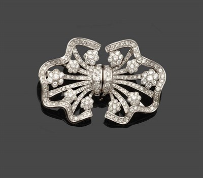 Lot 689 - A Diamond Brooch, as two joined fan shapes, five diamond clusters and diamond arms are set...